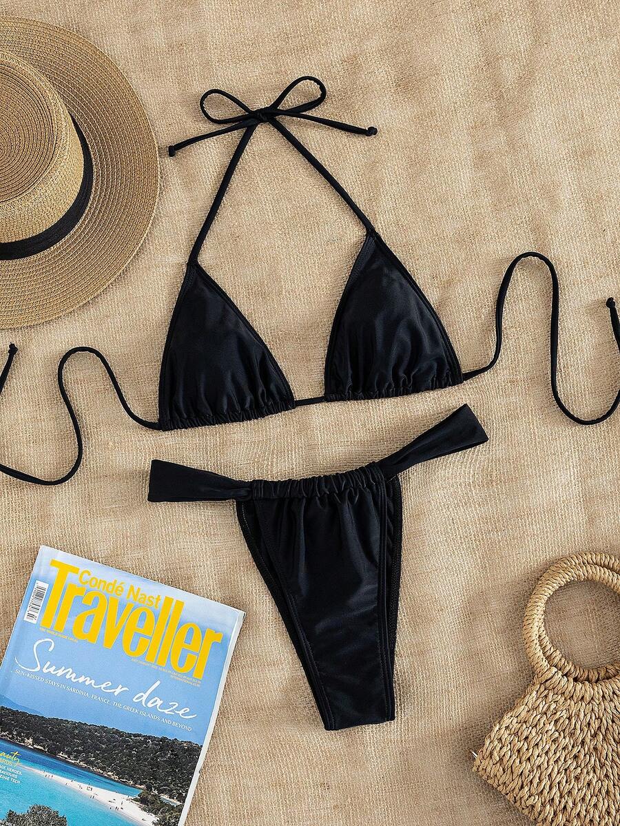 Women's striped halter two-piece swimsuit featuring a lace-up triangle top with removable padding and high-cut low-waist bikini bottoms.