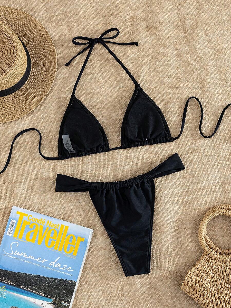 Women's striped halter two-piece swimsuit featuring a lace-up triangle top with removable padding and high-cut low-waist bikini bottoms.