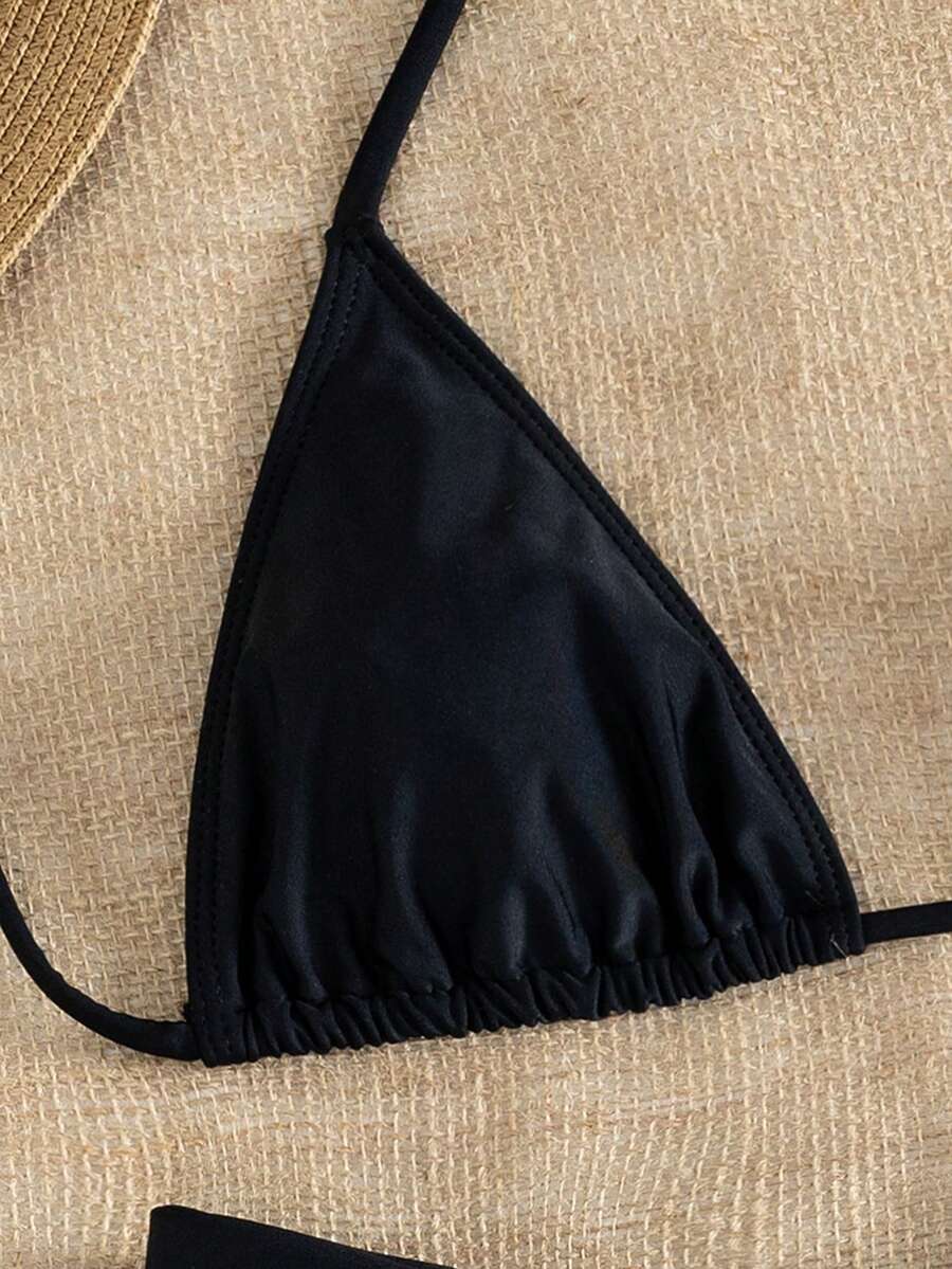 Women's striped halter two-piece swimsuit featuring a lace-up triangle top with removable padding and high-cut low-waist bikini bottoms.