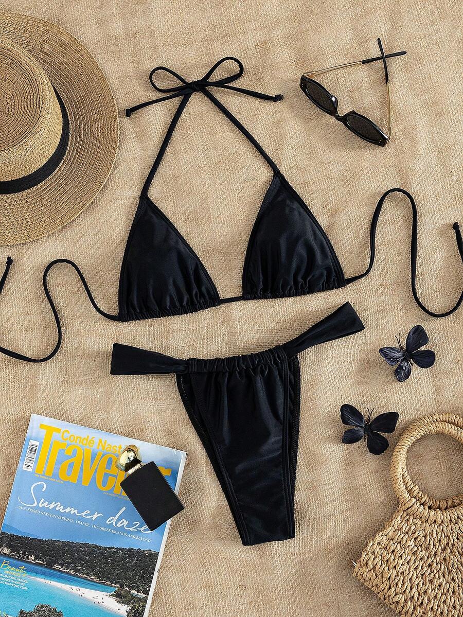 Women's striped halter two-piece swimsuit featuring a lace-up triangle top with removable padding and high-cut low-waist bikini bottoms.
