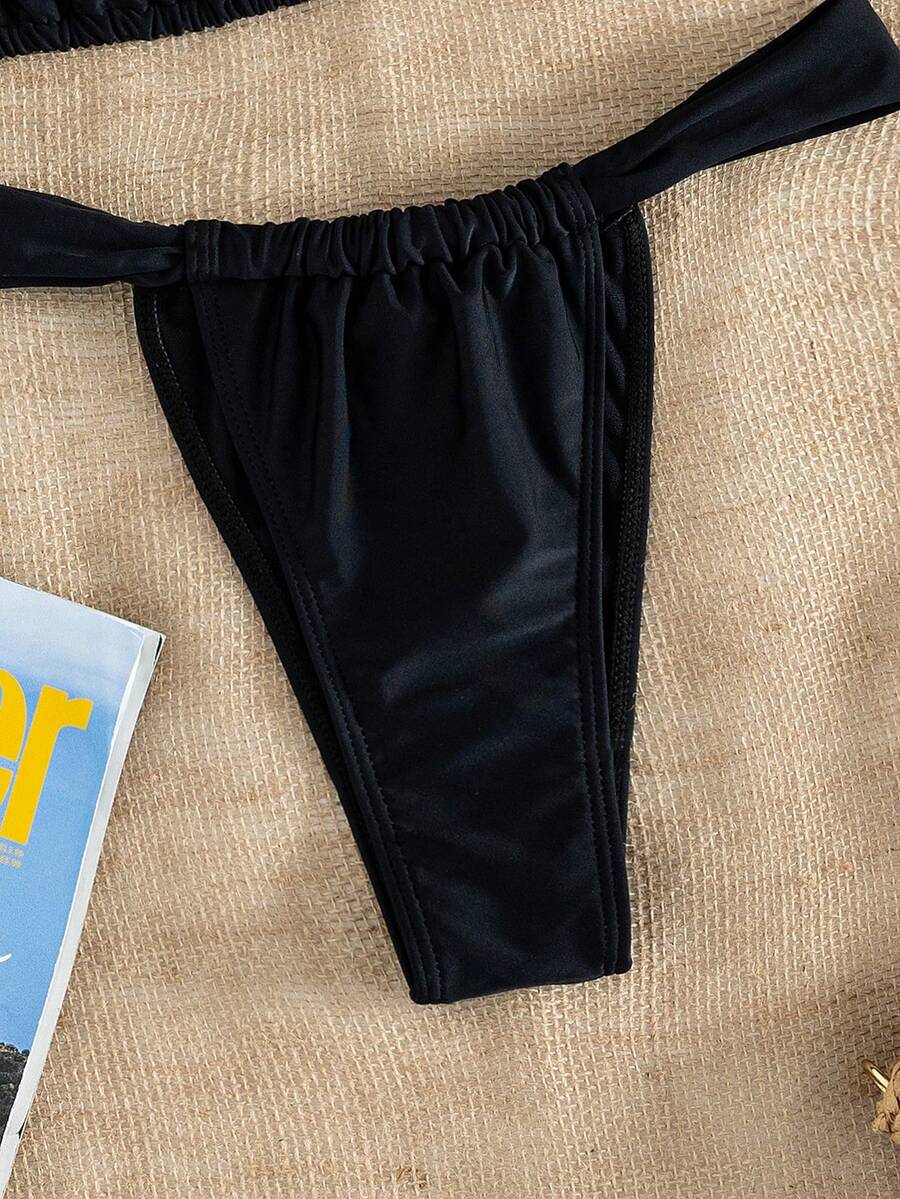 Women's striped halter two-piece swimsuit featuring a lace-up triangle top with removable padding and high-cut low-waist bikini bottoms.