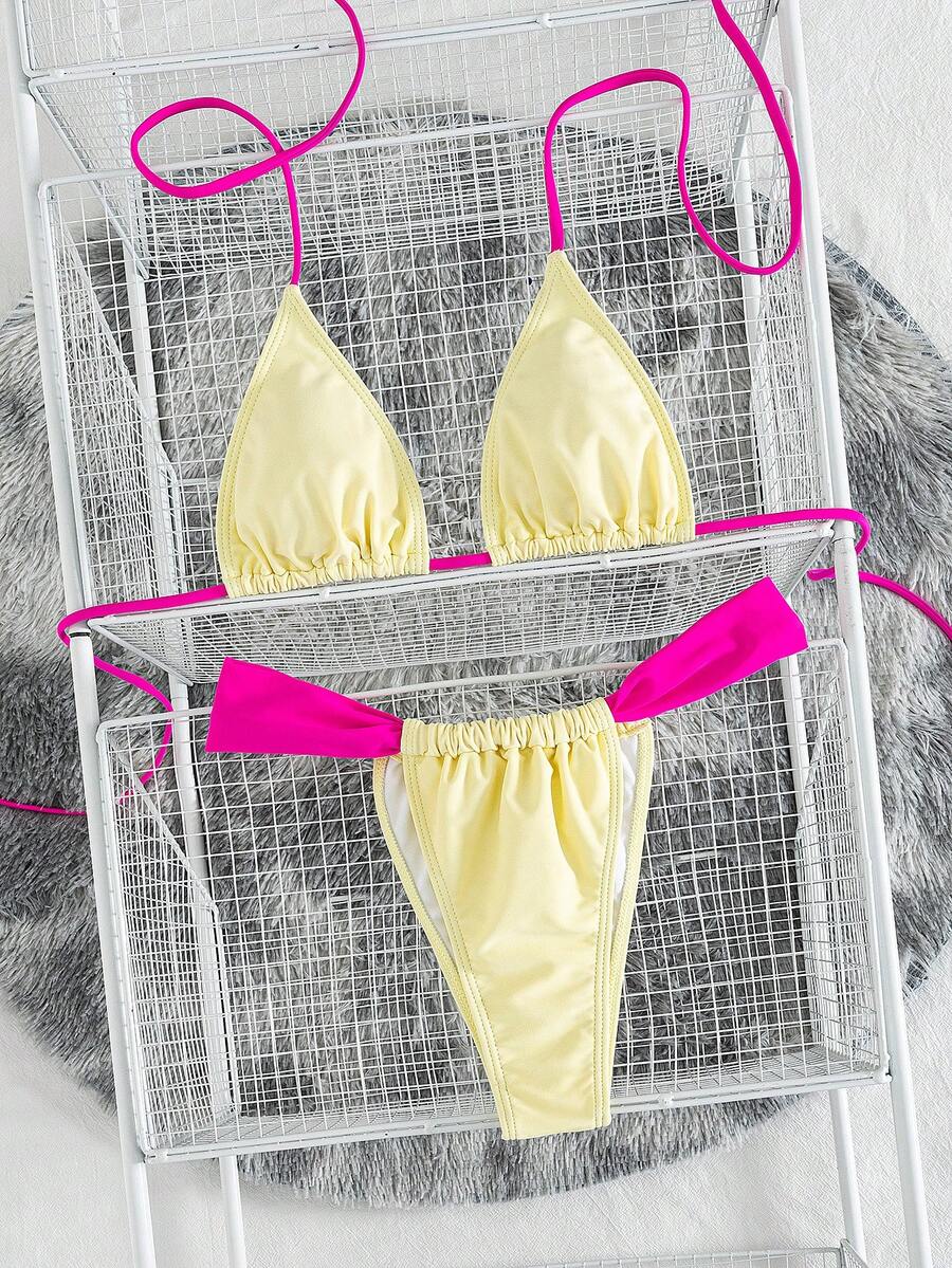 Women's striped halter two-piece swimsuit featuring a lace-up triangle top with removable padding and high-cut low-waist bikini bottoms.