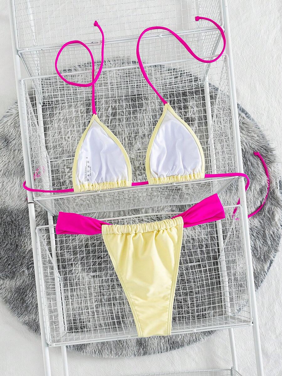 Women's striped halter two-piece swimsuit featuring a lace-up triangle top with removable padding and high-cut low-waist bikini bottoms.