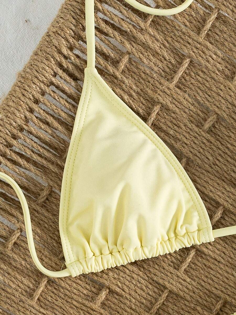 Women's striped halter two-piece swimsuit featuring a lace-up triangle top with removable padding and high-cut low-waist bikini bottoms.