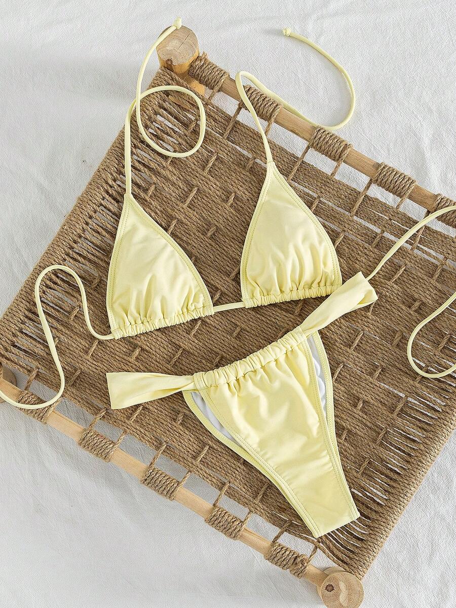 Women's striped halter two-piece swimsuit featuring a lace-up triangle top with removable padding and high-cut low-waist bikini bottoms.