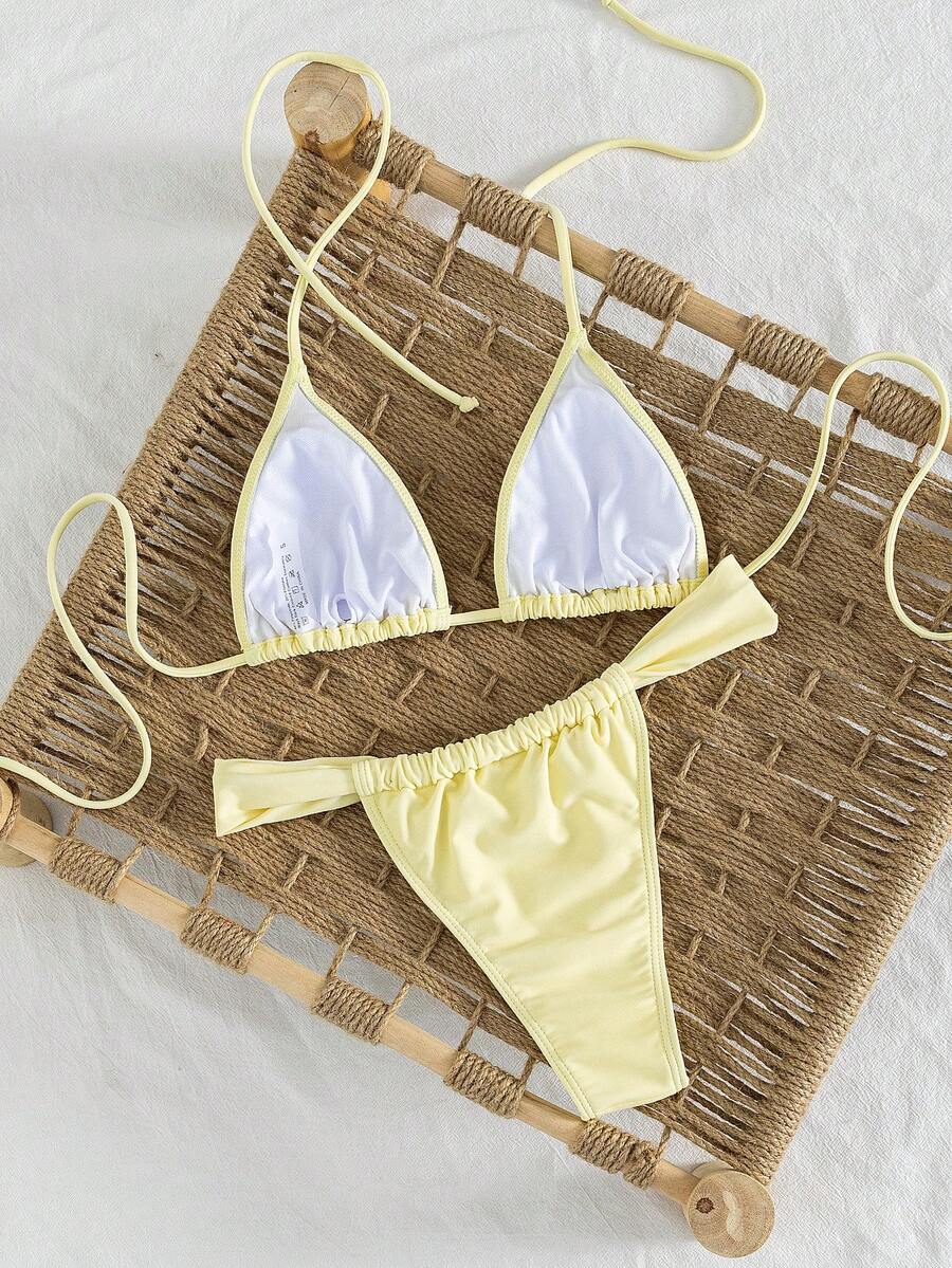 Women's striped halter two-piece swimsuit featuring a lace-up triangle top with removable padding and high-cut low-waist bikini bottoms.