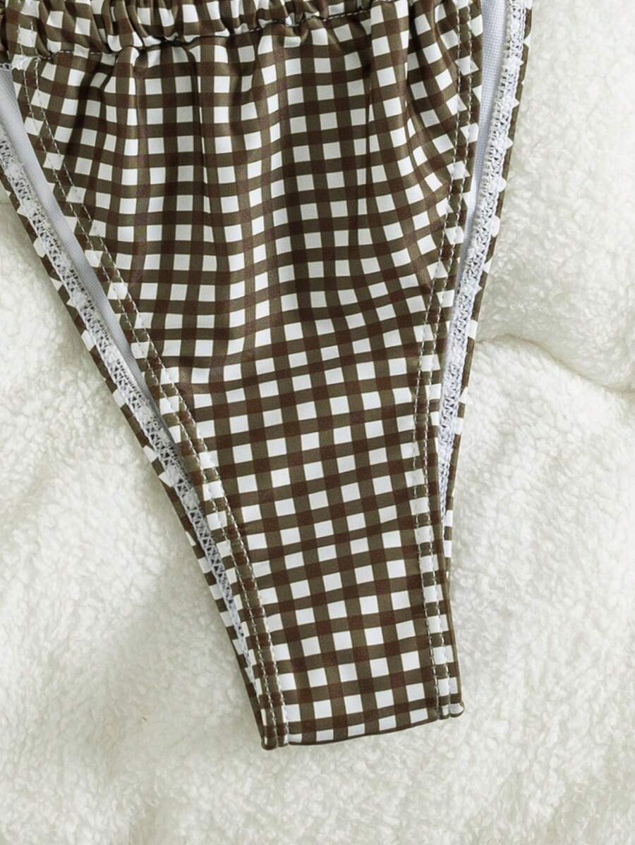 Women's striped halter two-piece swimsuit featuring a lace-up triangle top with removable padding and high-cut low-waist bikini bottoms.