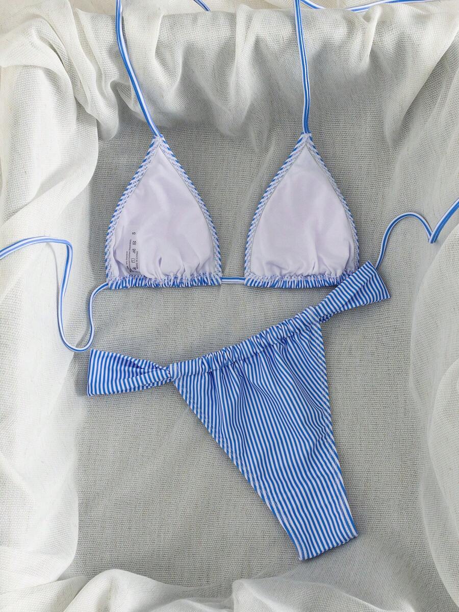 Women's striped halter two-piece swimsuit featuring a lace-up triangle top with removable padding and high-cut low-waist bikini bottoms.