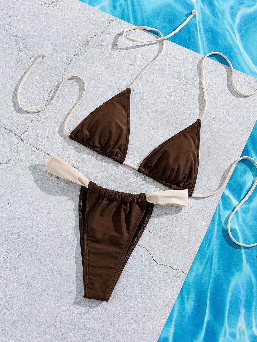 Women's striped halter two-piece swimsuit featuring a lace-up triangle top with removable padding and high-cut low-waist bikini bottoms.
