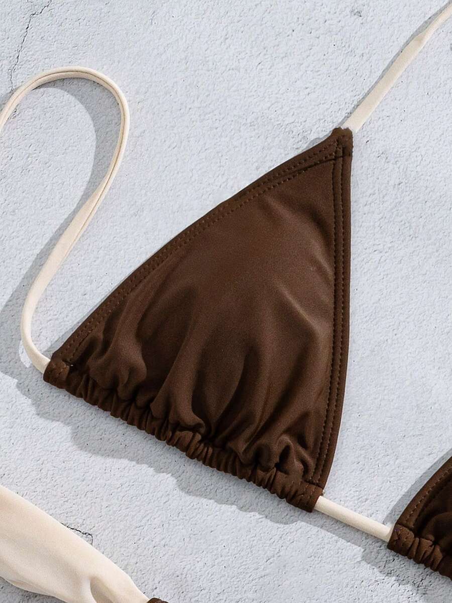 Women's striped halter two-piece swimsuit featuring a lace-up triangle top with removable padding and high-cut low-waist bikini bottoms.