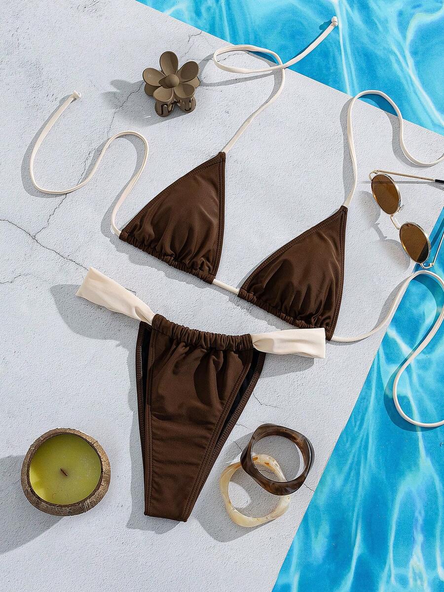 Women's striped halter two-piece swimsuit featuring a lace-up triangle top with removable padding and high-cut low-waist bikini bottoms.