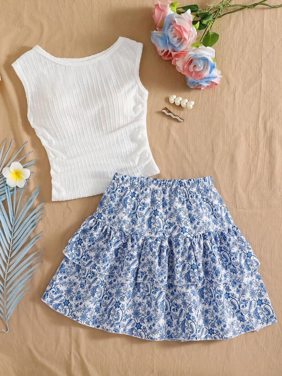 Light blue two-piece outfit set for tween girls with a sleeveless round neck vest top and a tiered ruffle cake skirt featuring a plant pattern.