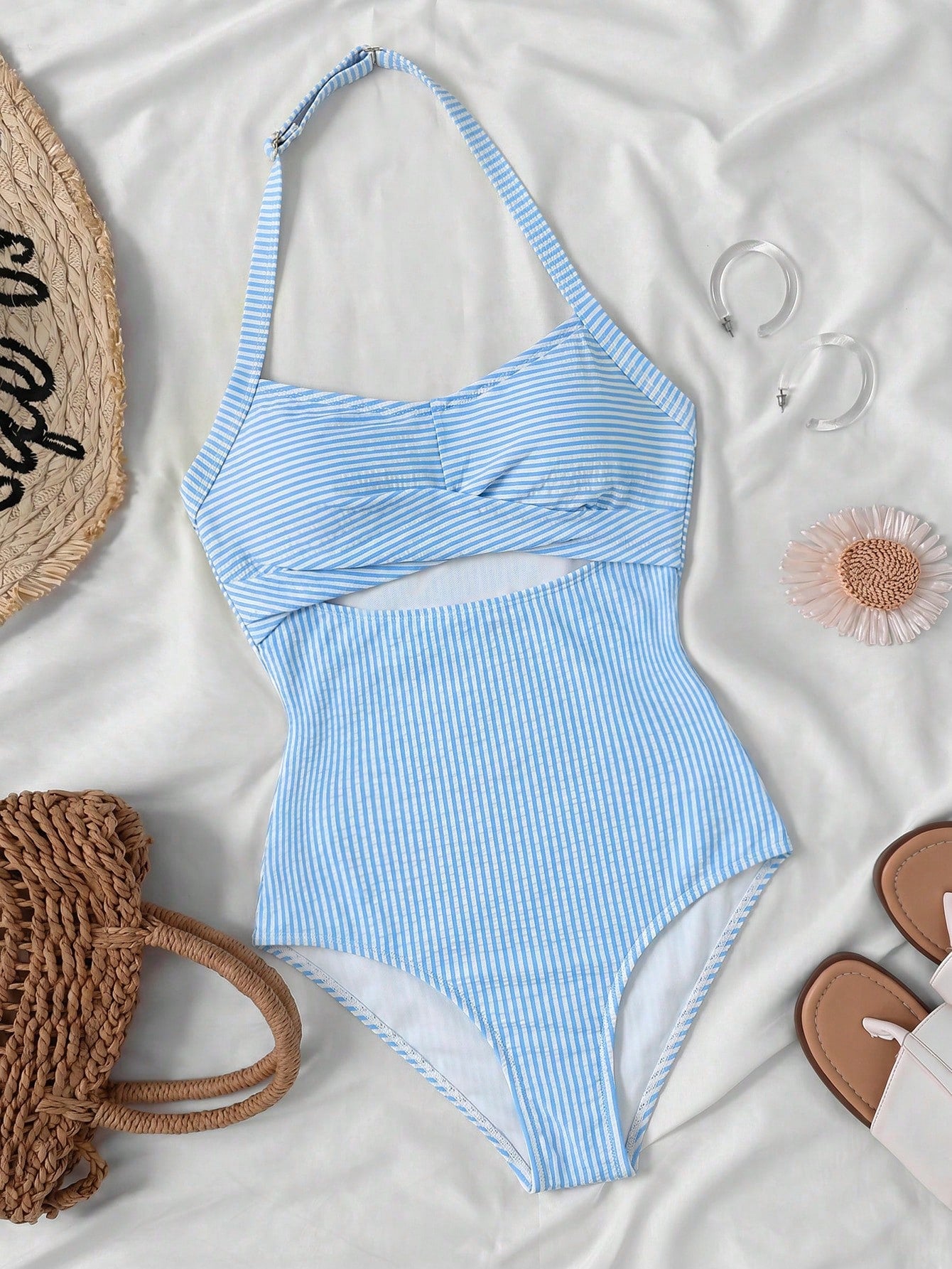 Tween girls one-piece swimsuit with polka dot-inspired all-over print, bow detail, spaghetti strap halter neckline, and lined stretch fabric for beach or vacation wear