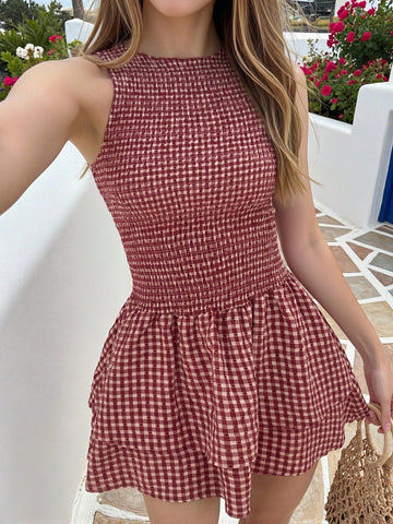 Tween girls sleeveless A-line mini dress in red and white plant pattern featuring round neck, high waist with ruffle and button details, and flounce hem.