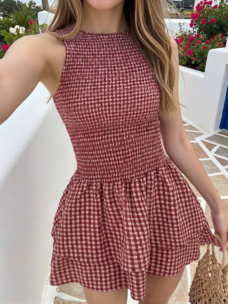 Tween girls sleeveless A-line mini dress in red and white plant pattern featuring round neck, high waist with ruffle and button details, and flounce hem.