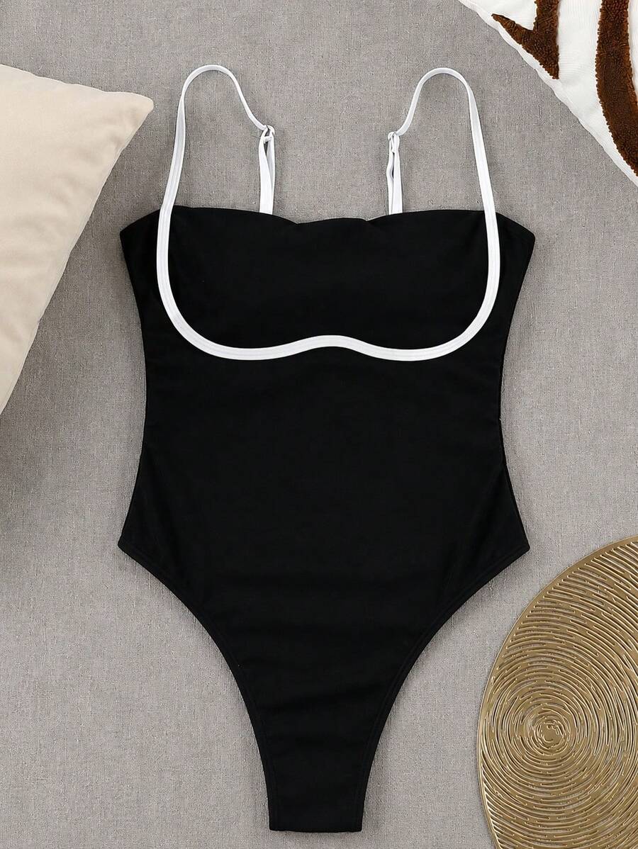 Black colorblock women's one-piece swimsuit with spaghetti straps and high stretch fabric.