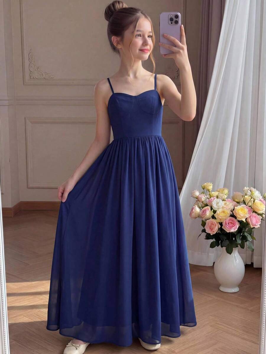 Tween girls apricot polka dot long cami dress with shoulder straps, high waist, and flared A-line skirt.