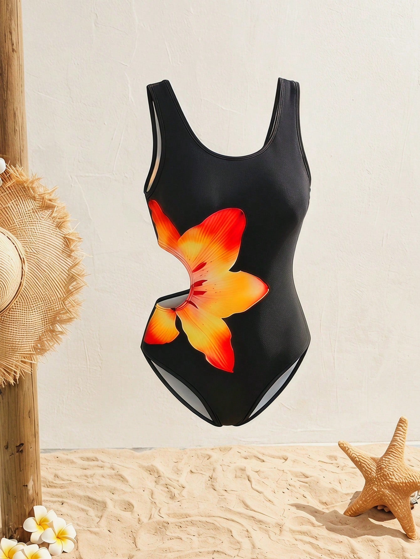 Tween girls' black and white one-piece swimsuit with striped patchwork design, scoop neck, asymmetrical cut-out detail, and fitted vacation swimwear style.