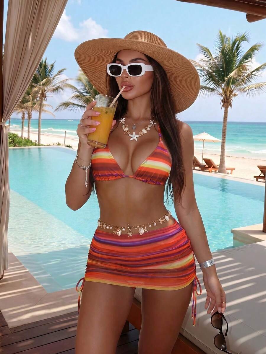 Women's black 3-piece bikini set featuring a halter triangle top with removable padding, high-waisted bottoms, and a knee-length mesh skirt with tie details.