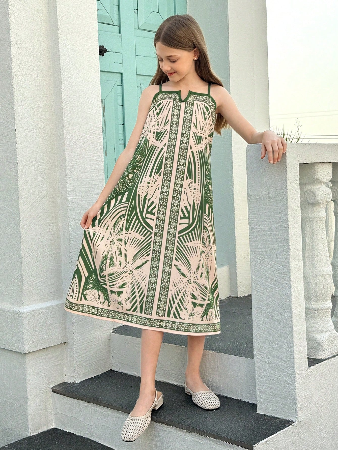tween girls multicolor all-over printed spaghetti strap boho cami dress with sleeveless design, natural waist, flared hem, and long slim fit silhouette.