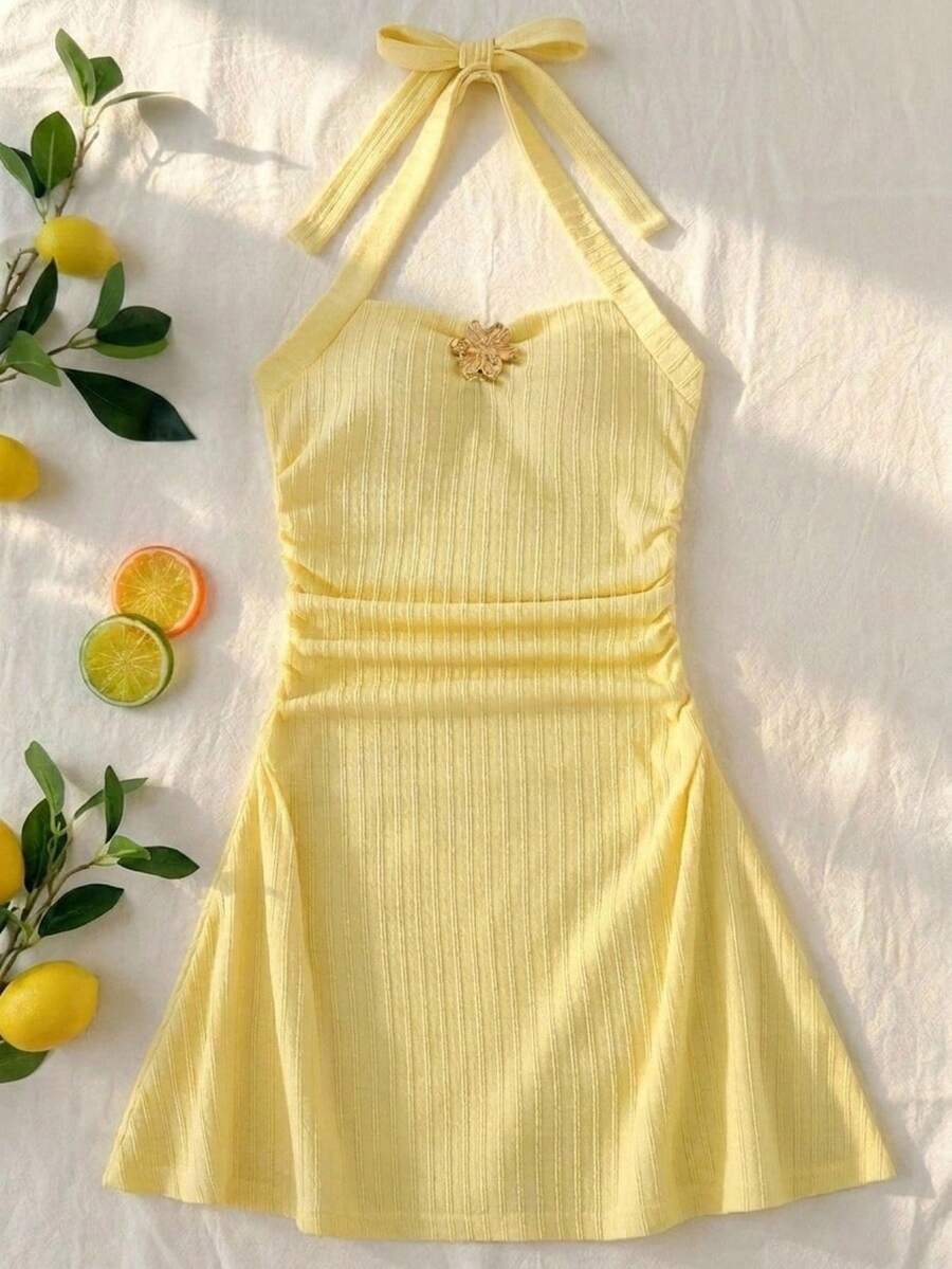 Apricot tween girls sleeveless halter cami dress with appliques, bow front, zipper detail, high waist, flared hem, and short slim fit design.