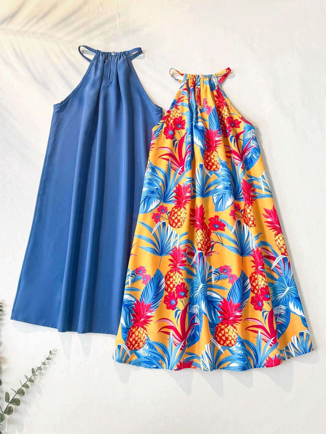 Tween girls floral print dress with halter neckline, sleeveless cold shoulder design, A-line shape, and vacation style.