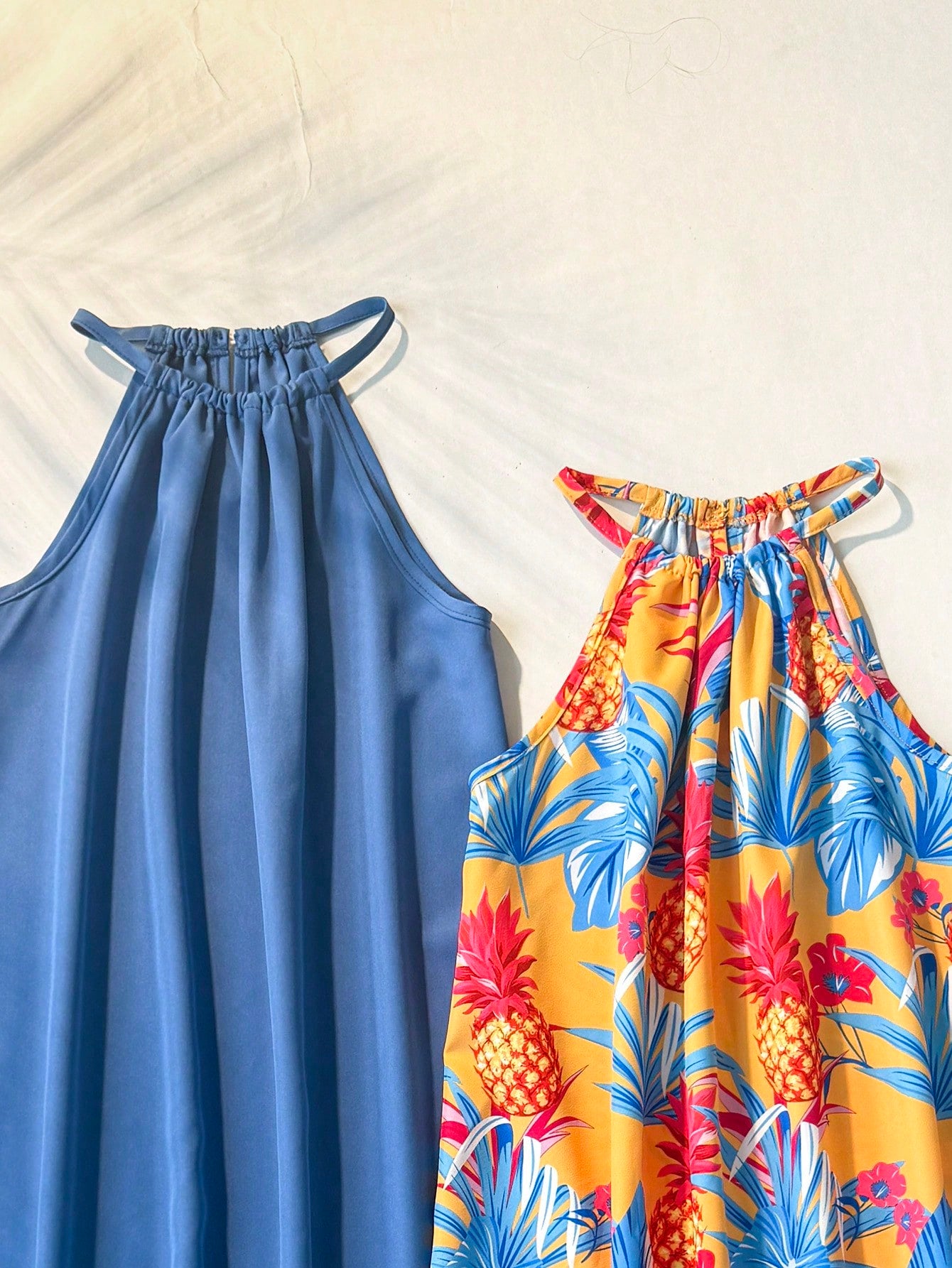 Tween girls floral print dress with halter neckline, sleeveless cold shoulder design, A-line shape, and vacation style.