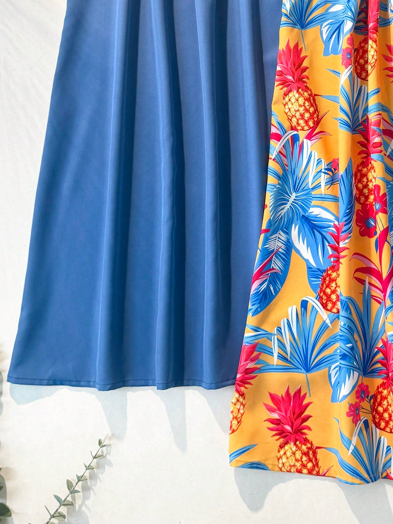 Tween girls floral print dress with halter neckline, sleeveless cold shoulder design, A-line shape, and vacation style.