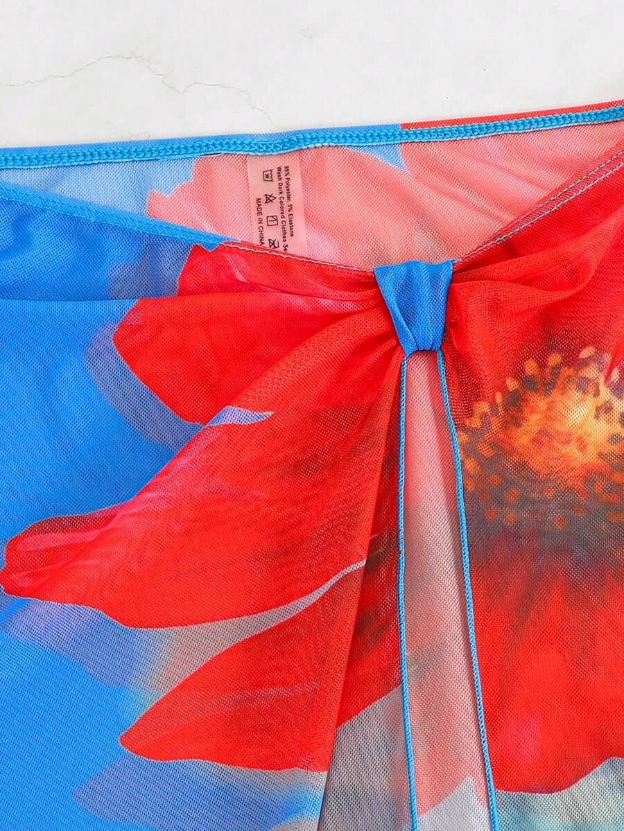 Women's 3-piece floral swimsuit set featuring a multicolor tie-back halter bikini top, low-waist bottoms, and a matching sheer mesh maxi skirt.