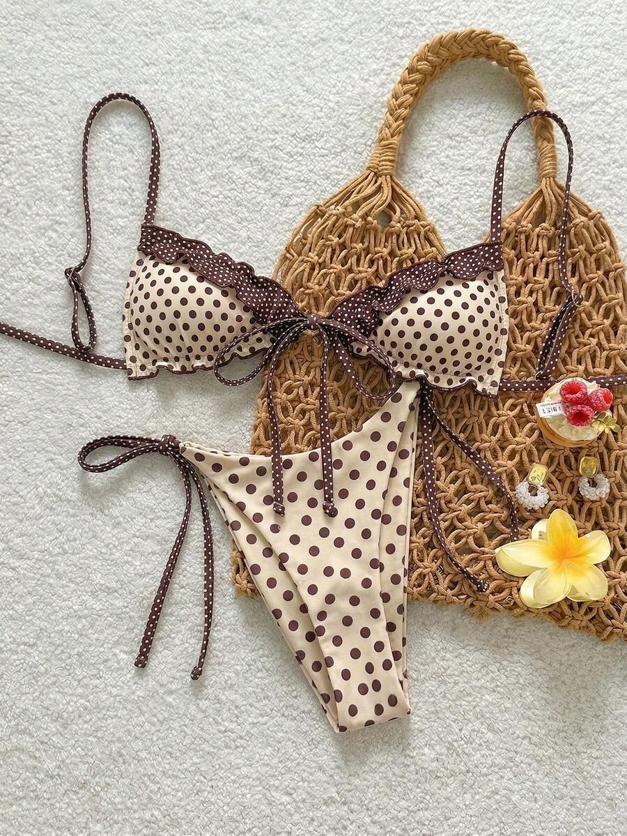 Women's beige two-piece bikini set featuring a wireless top with removable padding, spaghetti straps, tie back detail, and low waist hipster swimsuit bottoms.