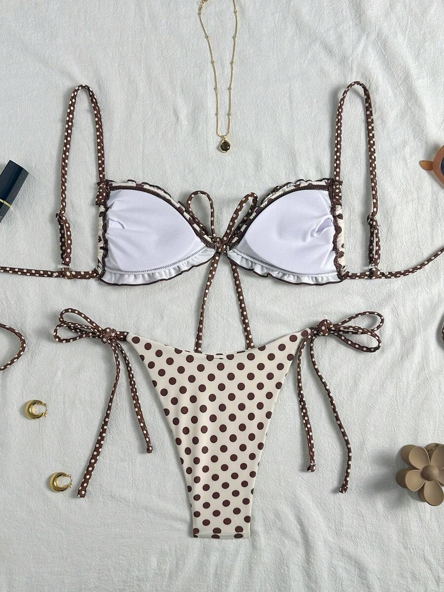 Women's beige two-piece bikini set featuring a wireless top with removable padding, spaghetti straps, tie back detail, and low waist hipster swimsuit bottoms.