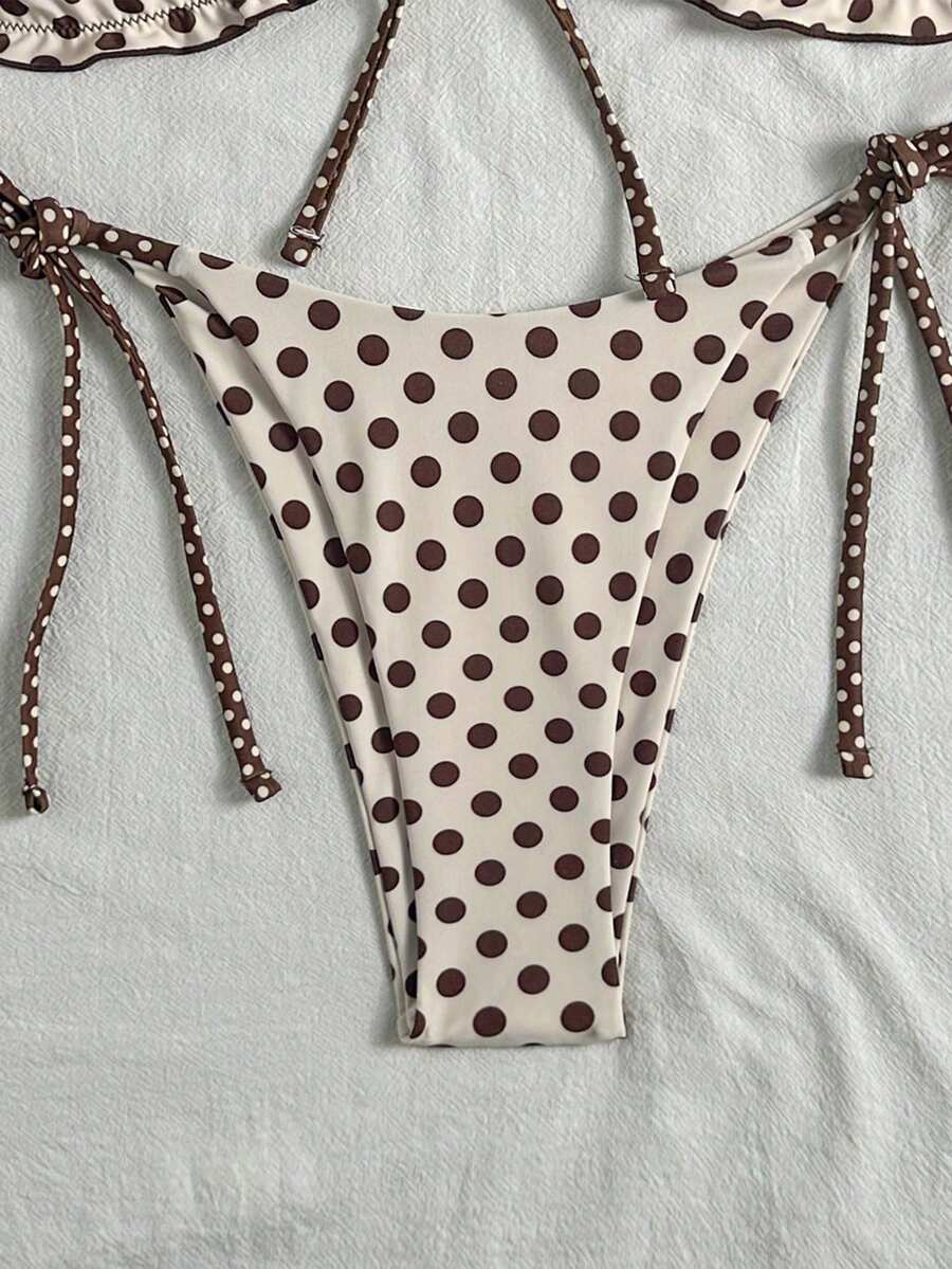 Women's beige two-piece bikini set featuring a wireless top with removable padding, spaghetti straps, tie back detail, and low waist hipster swimsuit bottoms.
