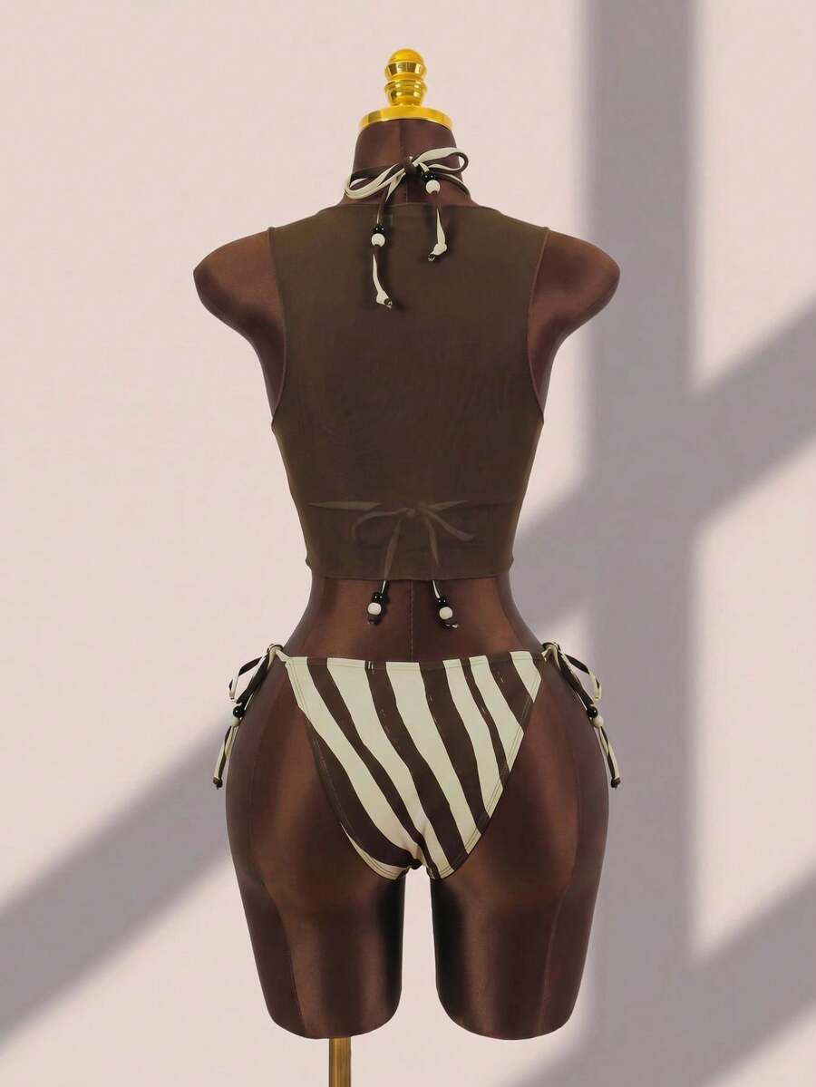 Brown striped 3-piece bikini set for women featuring a halter tie neck, wireless triangle cups with removable padding, cut-out details, and low waist tie side bottoms.
