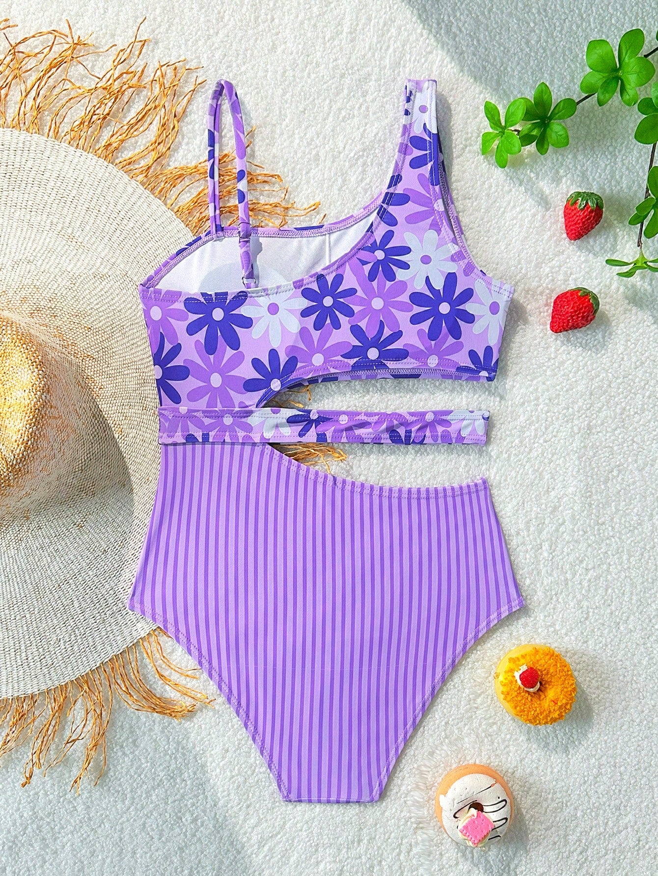 Purple tween girls one-piece swimsuit with asymmetrical neckline, cut-out waist, striped pattern, fitted silhouette, and lined body.