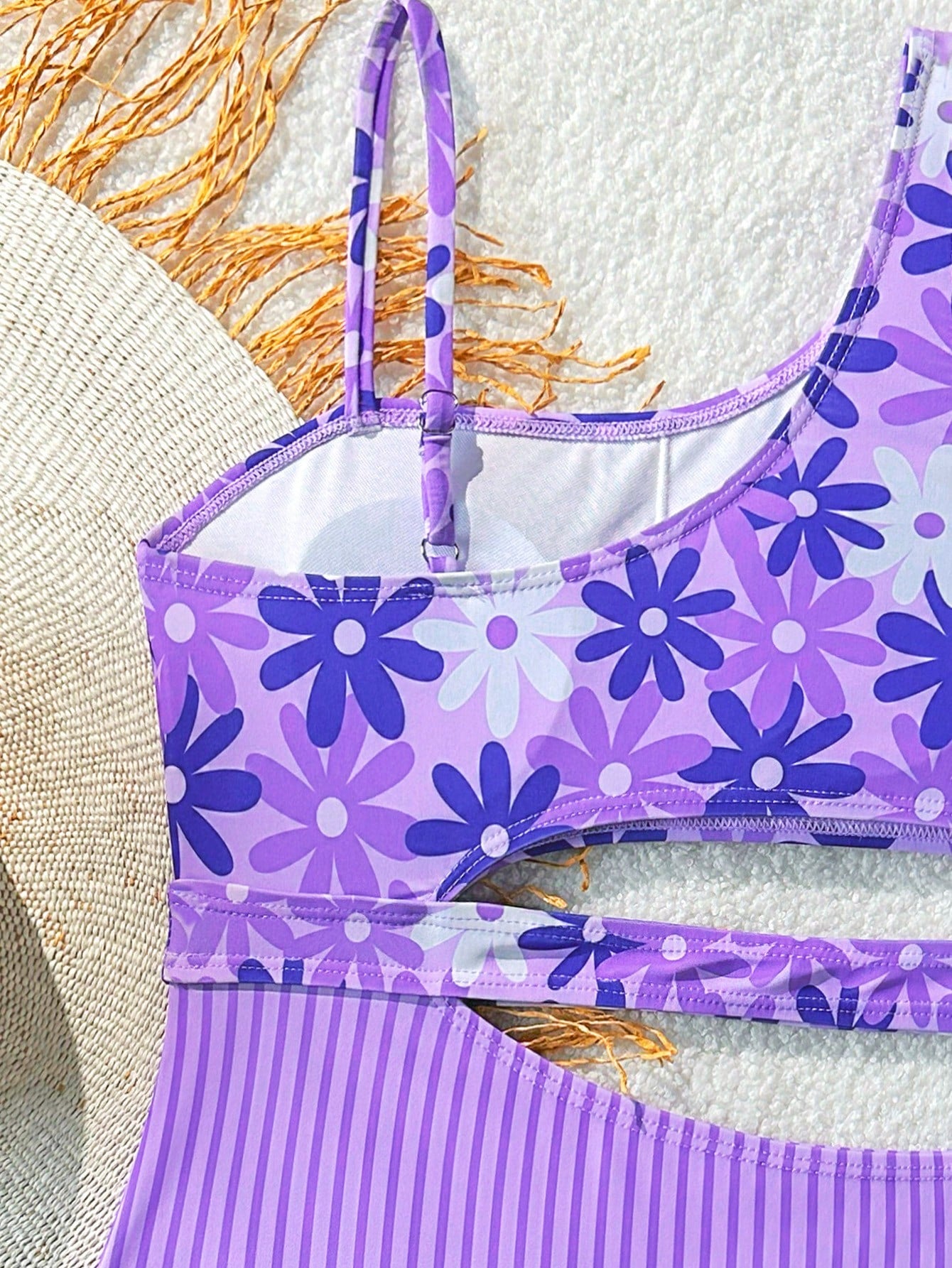 Purple tween girls one-piece swimsuit with asymmetrical neckline, cut-out waist, striped pattern, fitted silhouette, and lined body.