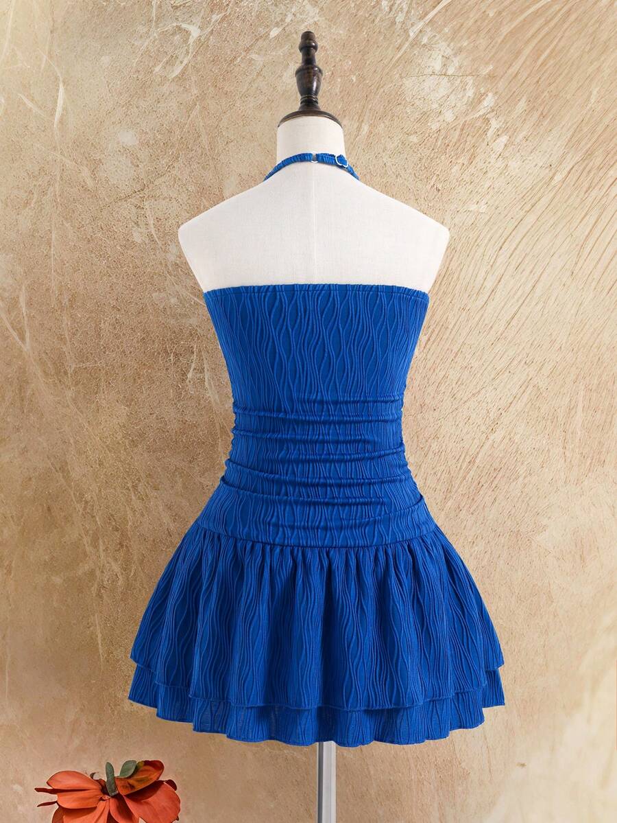 Tween girls apricot sleeveless halter mini dress with textured starfish and shell decor, shirred tiered layer, high waist, and flounce hem.