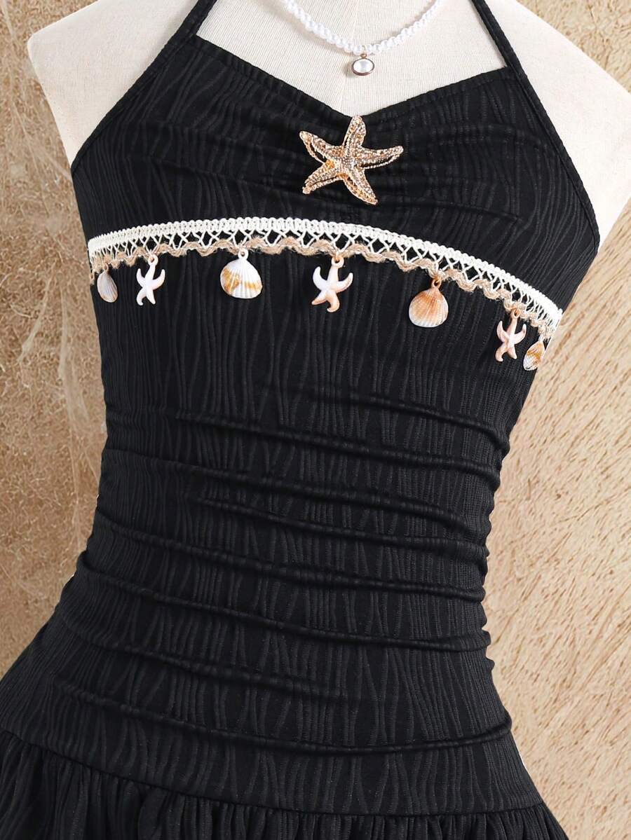 Tween girls apricot sleeveless halter mini dress with textured starfish and shell decor, shirred tiered layer, high waist, and flounce hem.