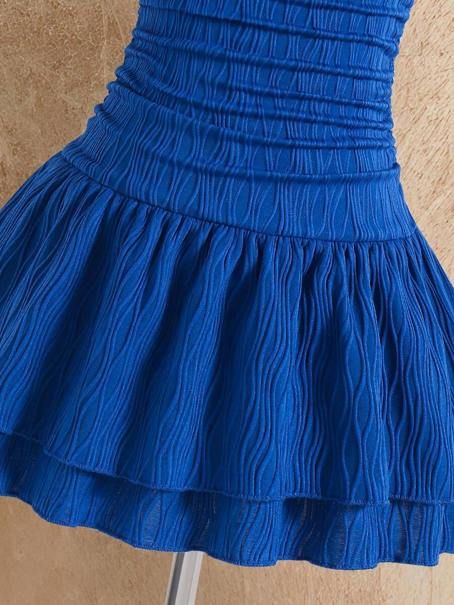 Tween girls apricot sleeveless halter mini dress with textured starfish and shell decor, shirred tiered layer, high waist, and flounce hem.