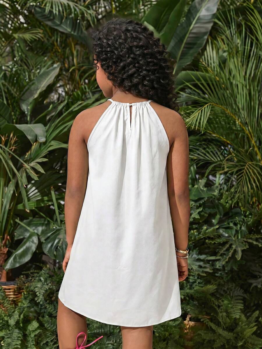 Tween girls floral halter A-line dress with contrast lace, applique and fringe details, sleeveless short length in polyester