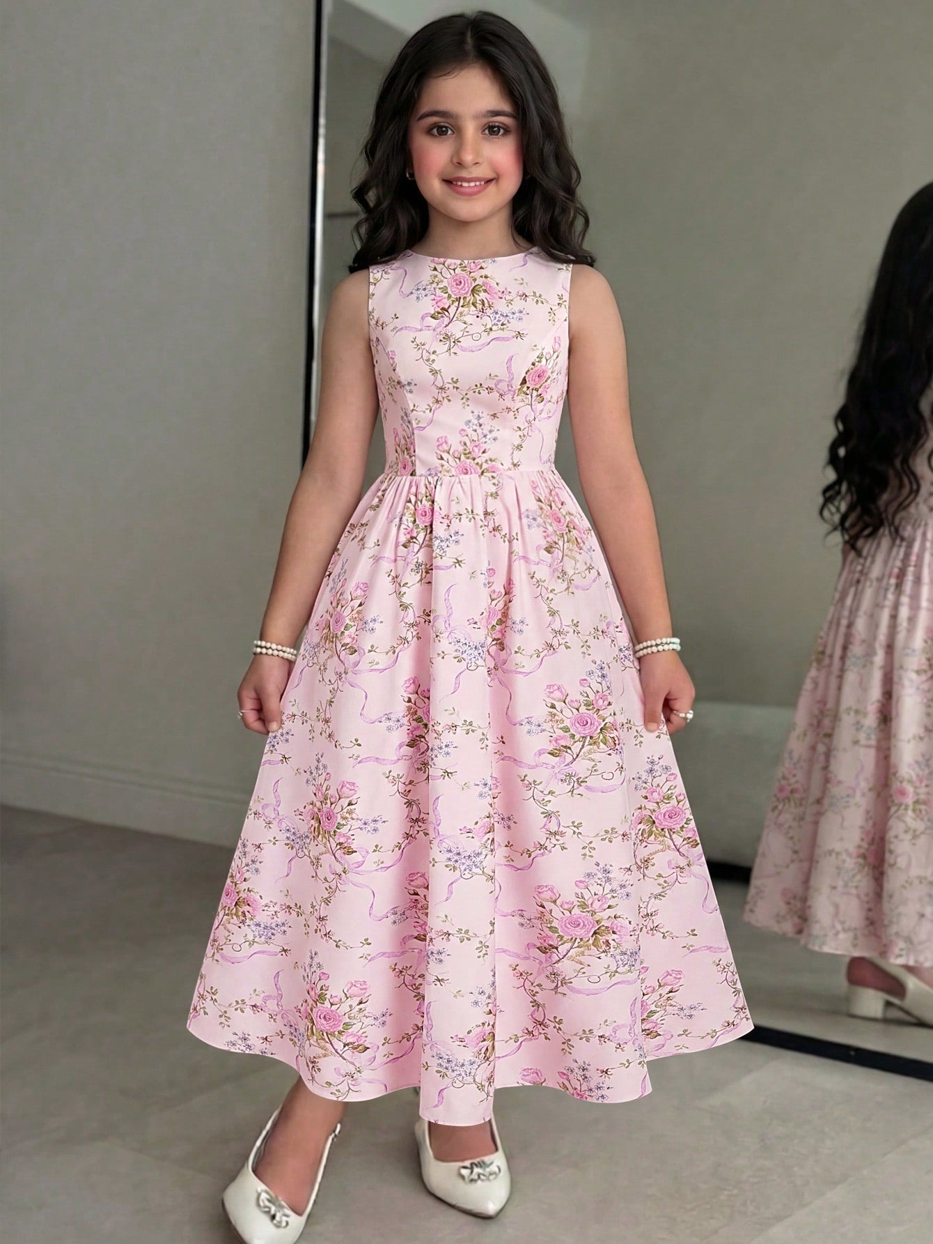 Tween girls pink floral sleeveless A-line midi dress featuring round neck, high waist with belt, contrast lace, and zipper back.