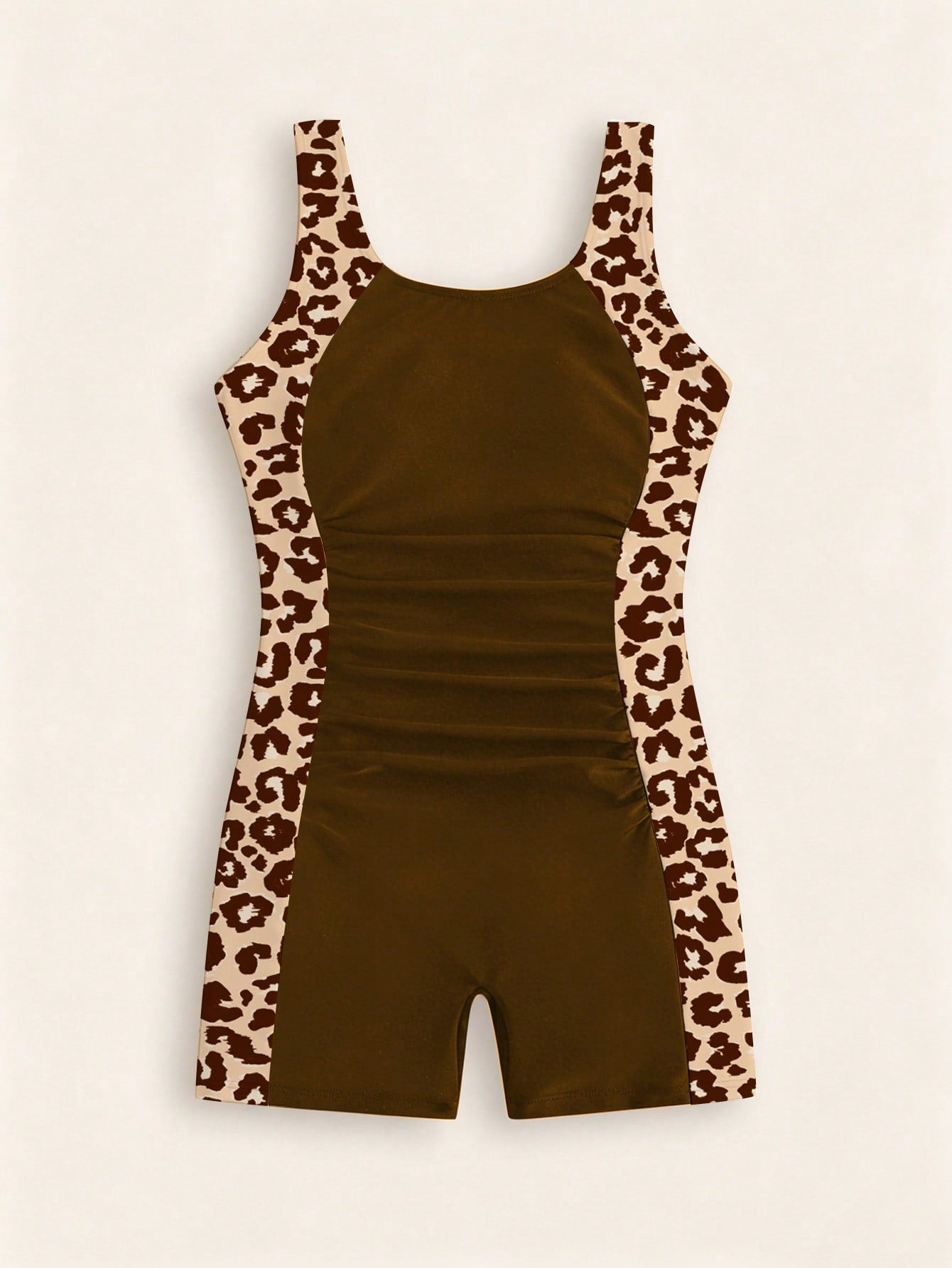 Tween girls one-piece swimsuit with scoop neck, contrast piping, short length, and shorts bottom for summer beach and vacation wear
