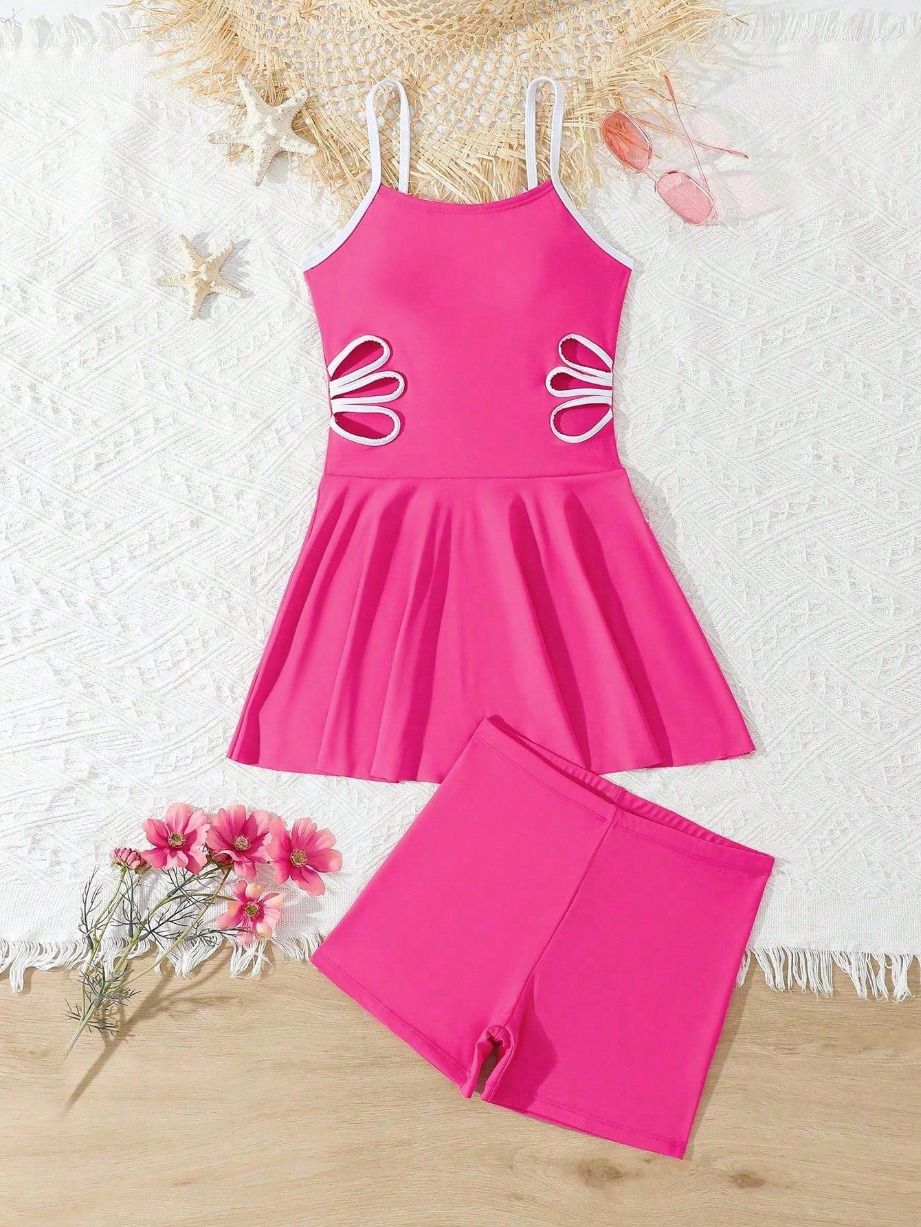 Tween girls black two-piece tankini swimwear set featuring a spaghetti strap sleeveless top with cutout detail and contrast piping, paired with short swim shorts.