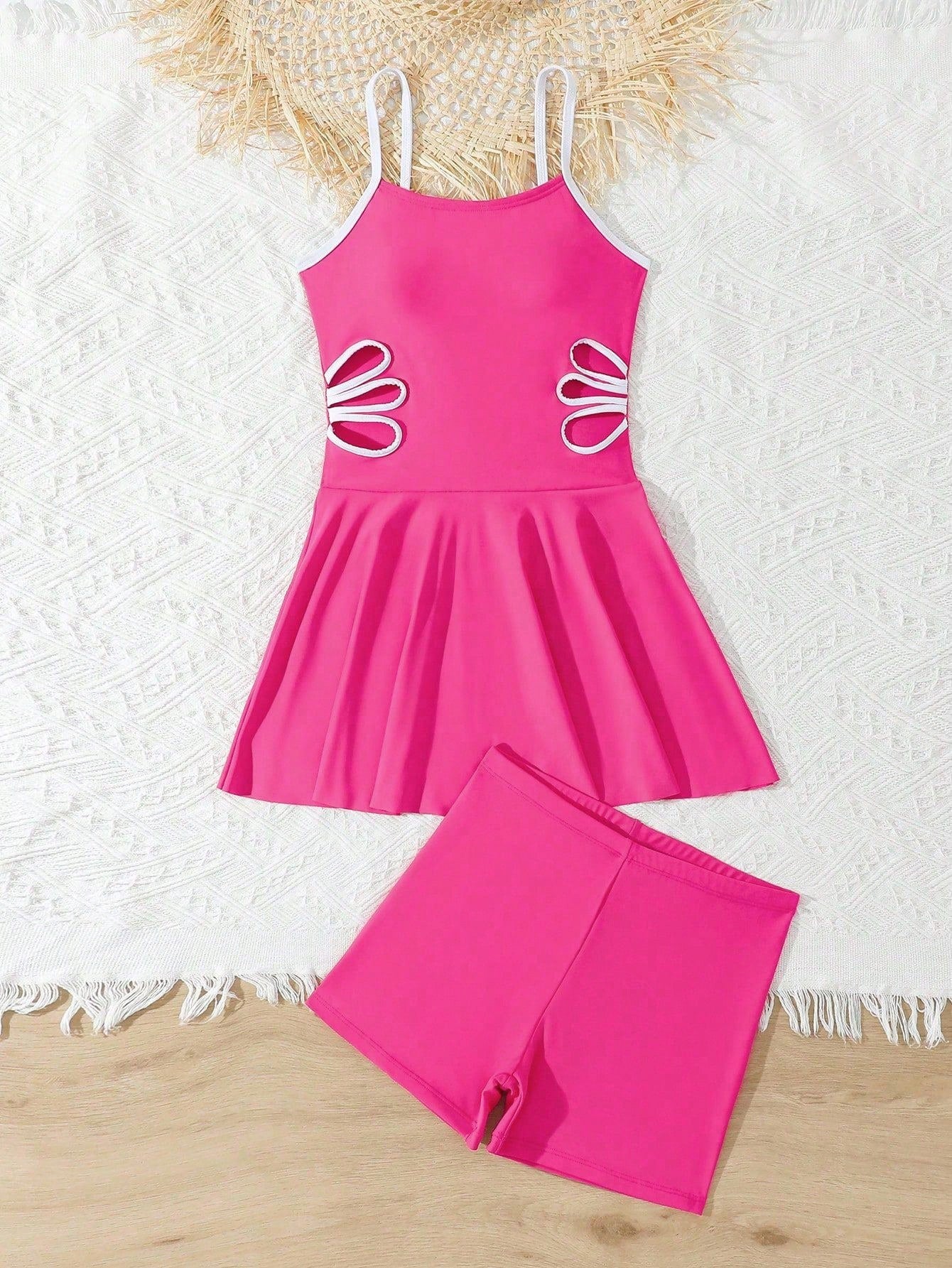 Tween girls black two-piece tankini swimwear set featuring a spaghetti strap sleeveless top with cutout detail and contrast piping, paired with short swim shorts.