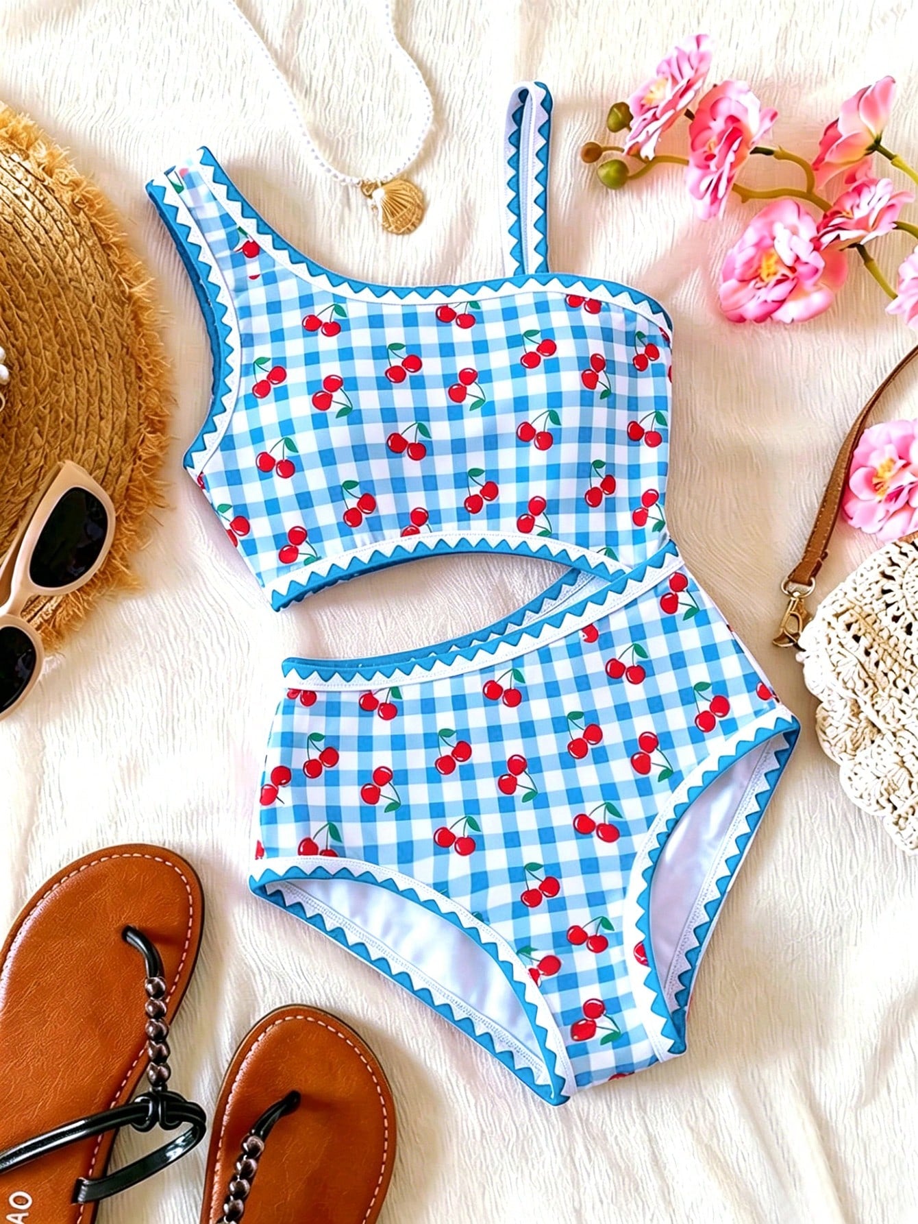 Tween girls one-piece swimsuit featuring an asymmetric neckline, pendant decor, plain design, wireless bra, high-cut bottom, and medium-stretch fabric.
