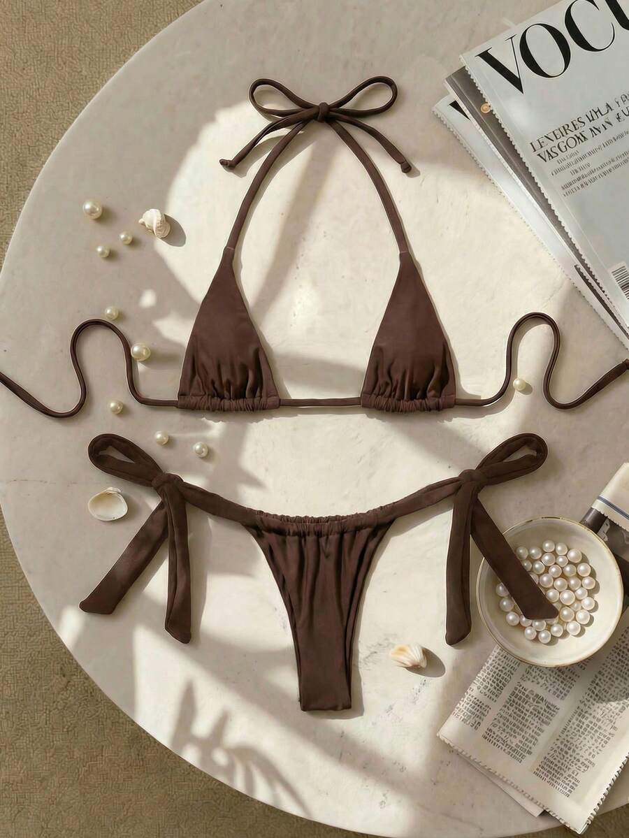 Army green high waist micro bikini swimsuit set for women featuring wireless spaghetti strap top with chain knot details and tie side thong bottoms.