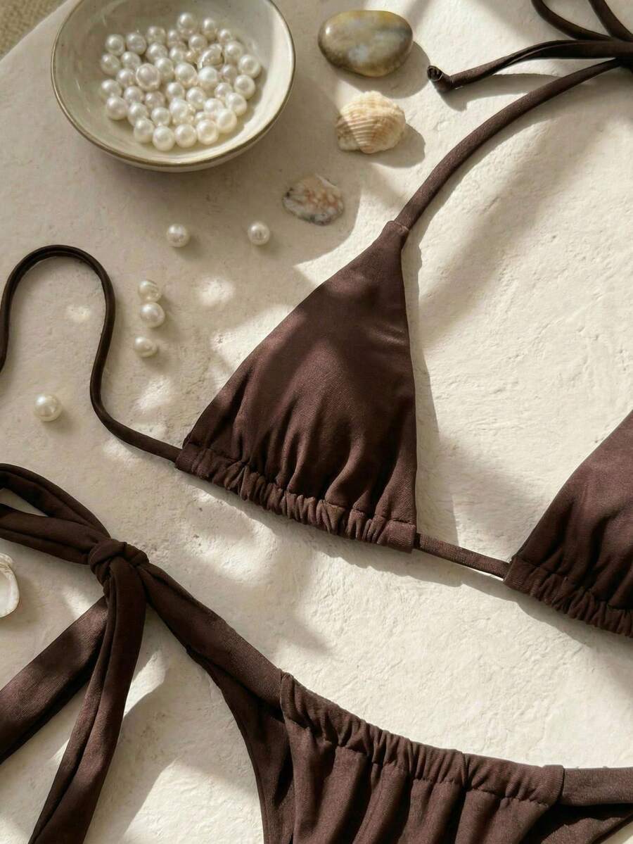 Army green high waist micro bikini swimsuit set for women featuring wireless spaghetti strap top with chain knot details and tie side thong bottoms.