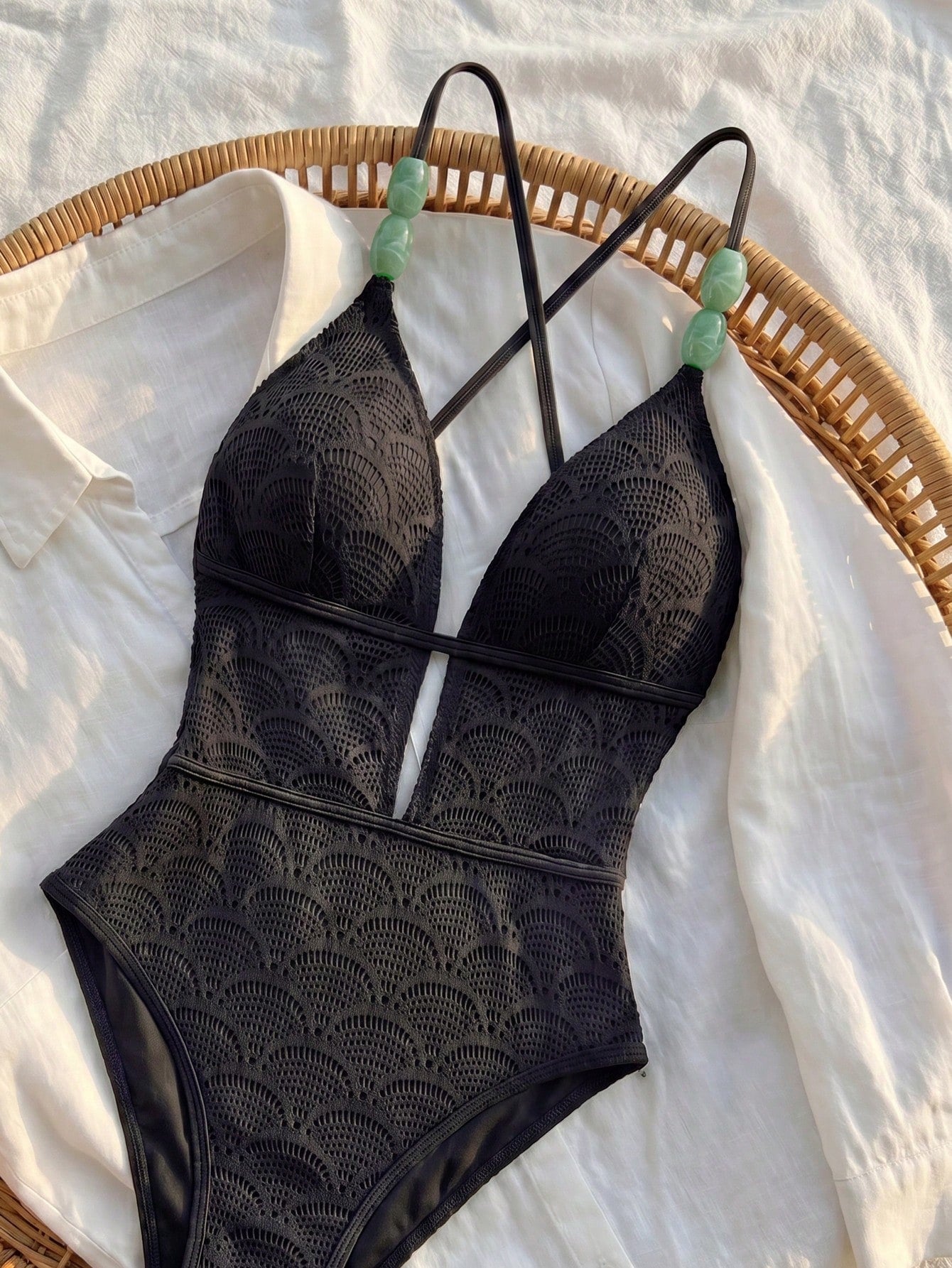 Women's fresh green boho one-piece swimsuit featuring a lace-up V-neckline, textured stretch fabric, and sleeveless design for beach and vacation wear.