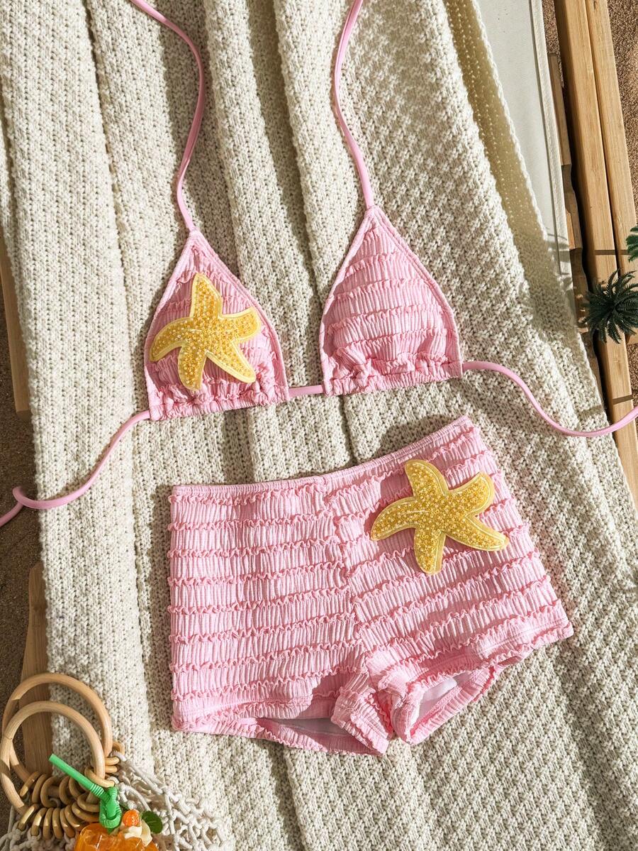Women's apricot two-piece swimsuit set with a halter tie-back top and matching high stretch shorts.