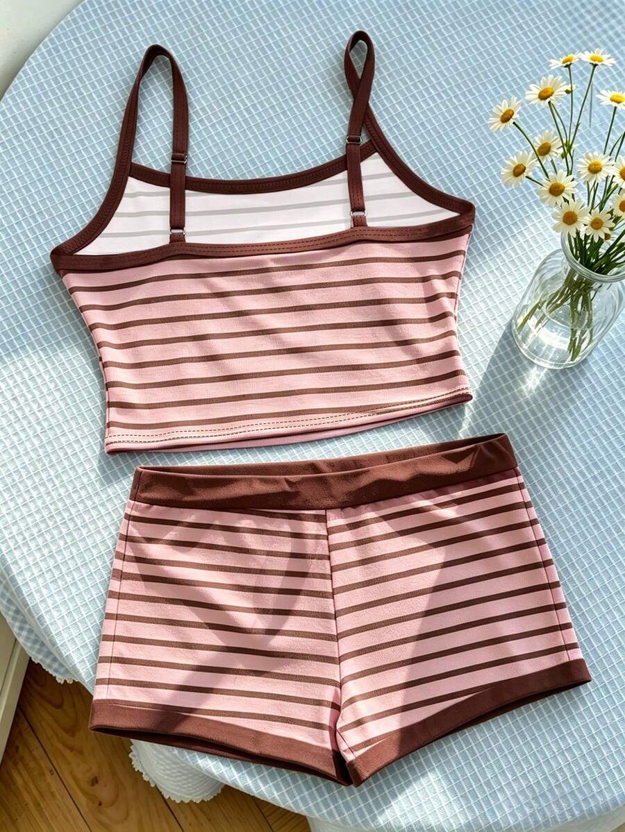 Tween girls summer 2-piece Hawaiian style outfit featuring a graphic print spaghetti strap camisole top with contrast piping and matching casual shorts.