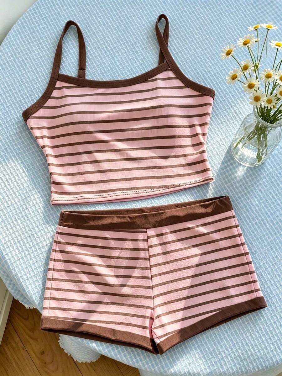 Tween girls summer 2-piece Hawaiian style outfit featuring a graphic print spaghetti strap camisole top with contrast piping and matching casual shorts.